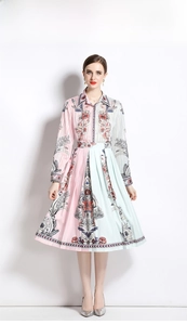 Close-up of pink and green floral print on the polyester blouse and pleated skirt