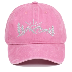 Close-up of pink washed cotton baseball cap with white mountain and tree scenery embroidery