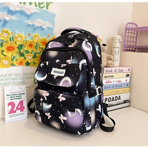 Close-up of black backpack with dreamlike purple moon, star, and butterfly patterns