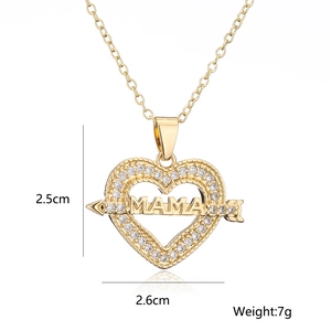 Detail view of 18K gold plated heart MOM pendant with zircons, size 2.6cm x 2.5cm