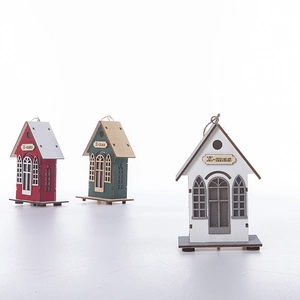 Glow wood Christmas house ornaments set with laser-cut X-mas detail on white backdrop