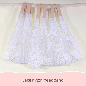 Detailed view of six different white lace patterns on elastic nylon headbands for babies