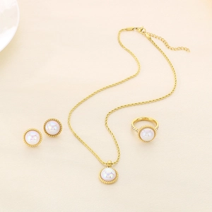 Close-up of gold-plated jewelry set with rainbow opals and small diamond accents