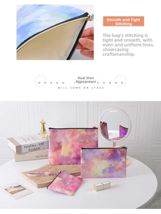 Vista dettagliata del set di 3 trousse colorate per il trucco in tessuto impermeabile