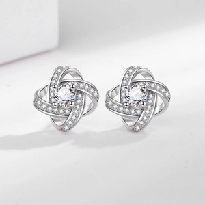 Elegant silver clover flower stud earrings with shimmering micro-paved cubic zirconia stones