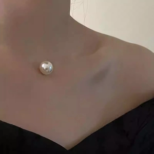 Elegant French style pearl pendant necklace with minimalist fine chain on model neck