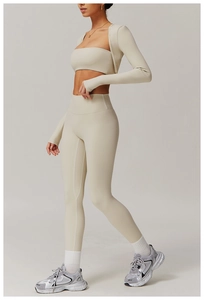 Detailed side view of off-white three-piece yoga set with sports bra and high-waist leggings