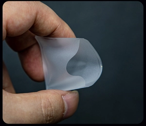 Detail of frosted semi-transparent plastic card sleeve with non-slip mesh texture