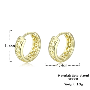Detail of gold plated copper earrings with hollow mesh texture and 1.4cm diameter
