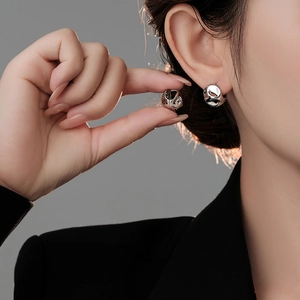 Minimalist silver irregular liquid metal hoop earrings with polished lava style finish