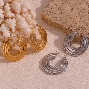 Exaggerated retro spiral textured hoop earrings in gold and silver stainless steel