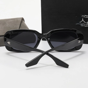 Polarized rectangular black sunglasses for women with silver metal temple accents and case