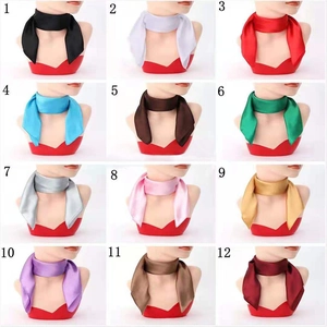 Macro display of 12 vibrant solid colors of square satin scarves in a 3x4 grid layout