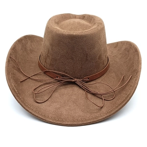 Detailed view of a brown suede western cowboy hat with leather band and stitching