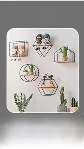 Detail of Nordic geometric wall shelves with black metal frames and wooden bases
