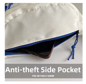Detail of off-white crossbody bag featuring a blue anti-theft side zipper pocket with phone