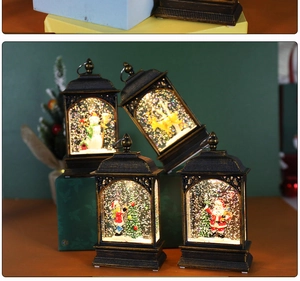 Close-up of vintage bronze Christmas lanterns with glowing snow scene and LED characters