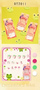 Close-up of children press-on nails featuring cute green frog and pink flower motifs