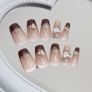 Deep brown gradient press-on nails with heart crystals and glitter in ballerina shape