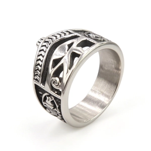 Vintage stainless steel Eye of Horus ring with gothic geometric patterns on a white background