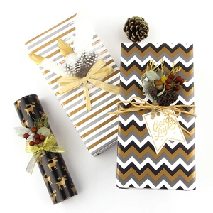 Premium gift wrapping paper with gold elk and stripe patterns for festive occasions