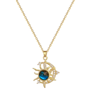 Elegant gold titanium necklace with star moon pendant and blue gemstone and crystals