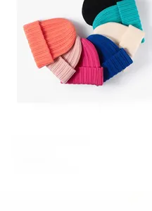 Detail of multi-color ribbed knit beanies showing various vibrant fabric textures
