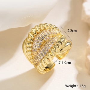 Macro shot of 18K gold plated ring with micro-pave zircon stones and twisted relief