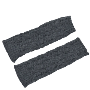 Detail shot of dark gray cable knit arm warmers with intricate texture on white background