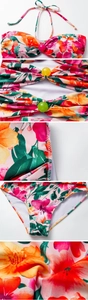Detail of floral swimwear showing colorful decorative beads and ruffled texture on fabric