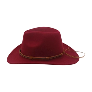 Detail of burgundy felt fedora hat featuring a brown braided leather band and tassels