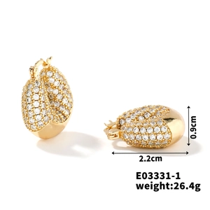 Detail view of chunky gold earrings with cubic zirconia, size 2.2cm x 0.9cm, weight 26.4g