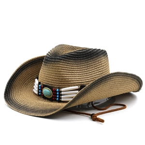 Detail of woven straw cowboy hat with ethnic turquoise beaded band and chin strap