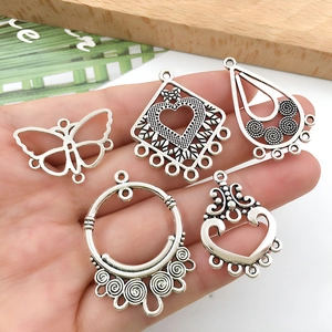 Vintage silver alloy jewelry connectors in butterfly and heart shapes for DIY earrings