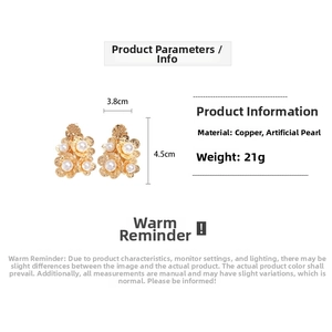 Close-up of 18K gold plated flower earrings with pearls showing 3.8cm x 4.5cm dimensions