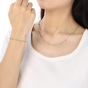 Conjunto collar pulsera minimalista de acero inoxidable con cuentas azules en modelo