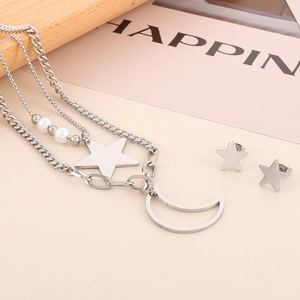 Silver layered necklace with star and moon charms plus matching stud earrings set