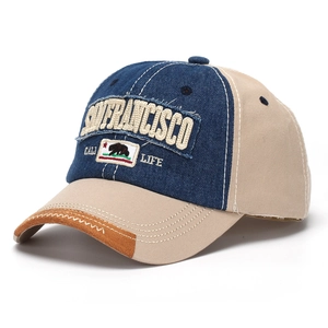 Detail of San Francisco embroidery and California bear patch on vintage denim cap