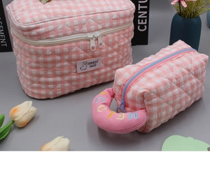 Pink checkered quilted makeup bag and pencil case set with embroidered handles and details