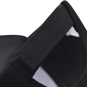 Close-up of the adjustable velcro strap and premium twill texture on a black baseball cap