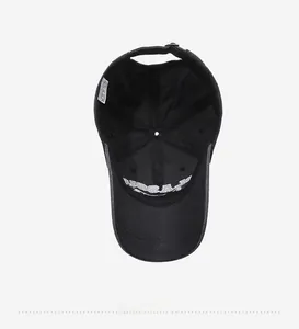 Internal view of a washed denim baseball cap with visible stitching and care label