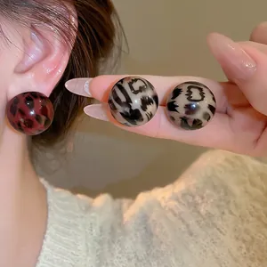 Polished round resin leopard print stud earrings in red and beige for women