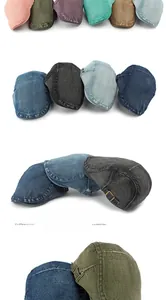 Detail of vintage washed denim newsboy caps showing multiple colors and metal buckles