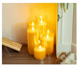 Set of four LED flameless candles in glass jars with realistic flickering warm glow
