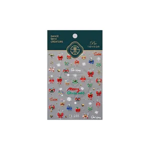 Christmas nail stickers with 3D snowflakes and colorful bows designs on white background