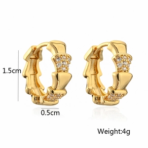 Detail showing bamboo style gold earring dimensions of 1.5cm by 0.5cm and weight of 4g