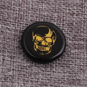 Polished black and gold skull coin pendant for DIY jewelry and gothic accessories