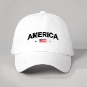 Detailed close-up of America 1776 embroidery on white cotton baseball cap