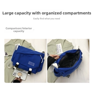 Detail showing the large capacity and functional internal pockets of blue messenger bag