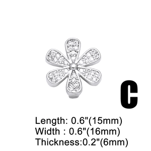 Detailed view of silver flower charm with cubic zirconia stones, size 15mm by 16mm